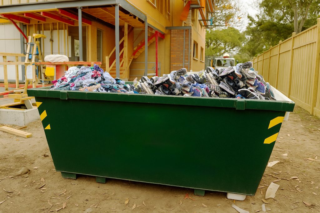 Clothes in a Skip Bin