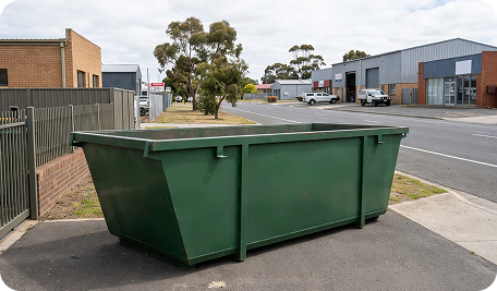 Skip Bin Hire Moonah truck delivering a skip bin to a commercial property for waste removal service in Moonah
