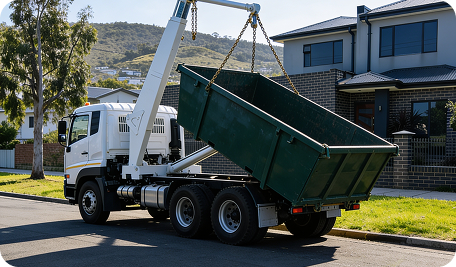 Skip bin truck delivering a bin in front of an Acton Park home for easy garden waste, renovation, and property clean-ups